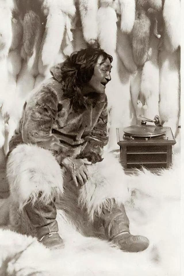 Restored photo of Inuit person with gramophone