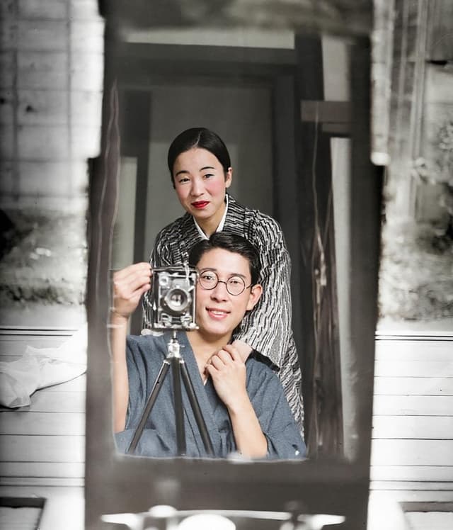 Restored photo of Japanese couple with camera